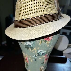 Elegant Tan Hat with Black Feather Accents